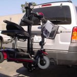 TRILIFT Ultra Lite carrying a Pride gogo on a Ford Explorer.